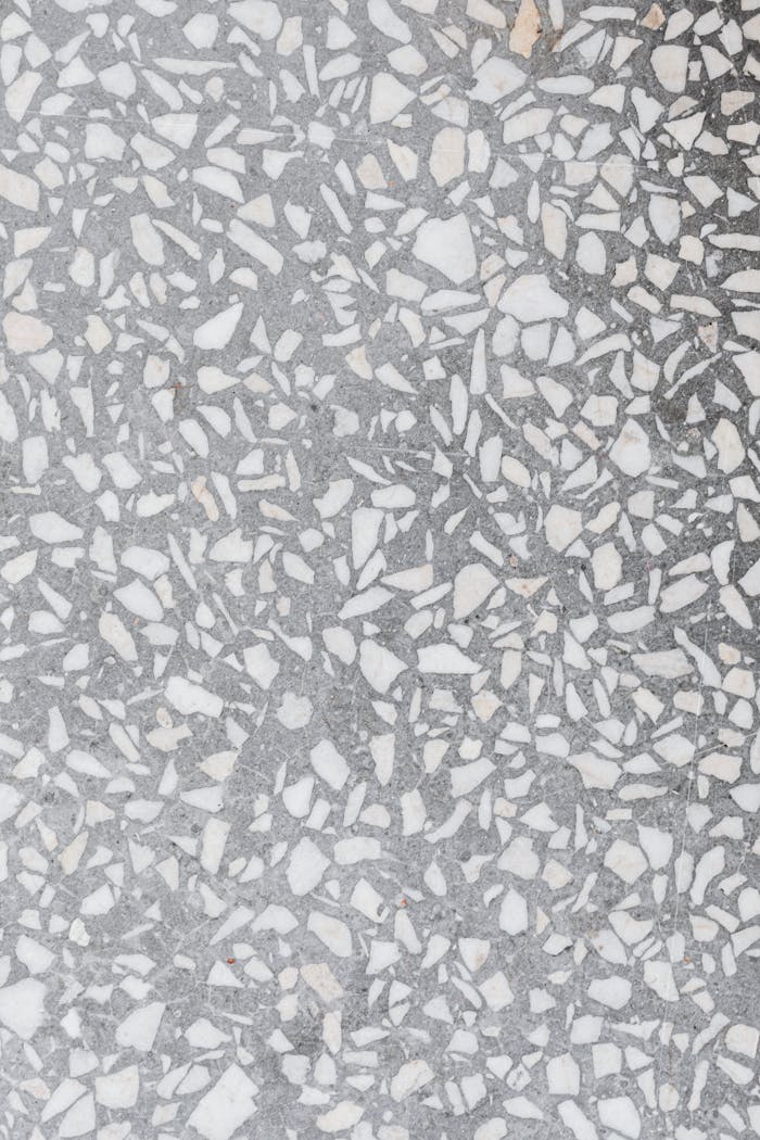 Detailed shot of a terrazzo floor showcasing intricate mosaic patterns.